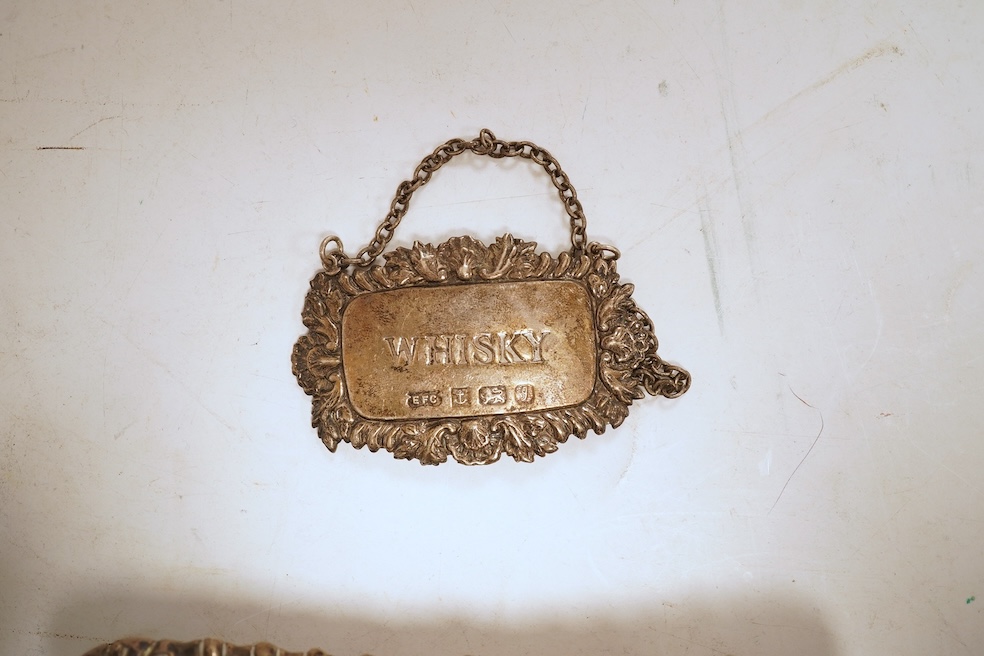 A collection of small silver including a pair of Edwardian rectangular dishes, Thomas Woolley, Birmingham, 1901, 13.2cm, a mug, two handled cup, cigarette case, photograph frame, toast rack, wine label, sovereign case et